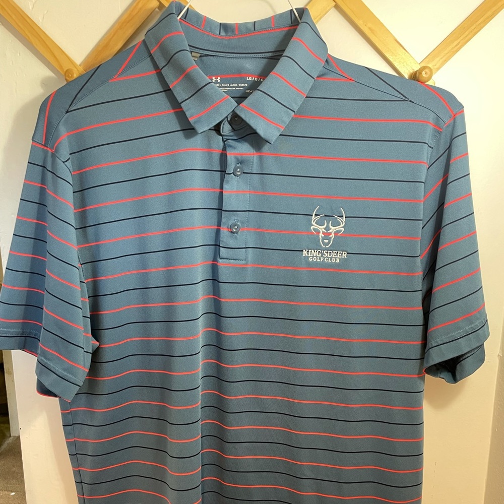 Size large blue Under Armour golf polo with King’s Deer Golf Club logo on chest.